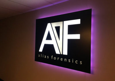Picture of halo illuminated interior conference room sign for Alias Forensics.