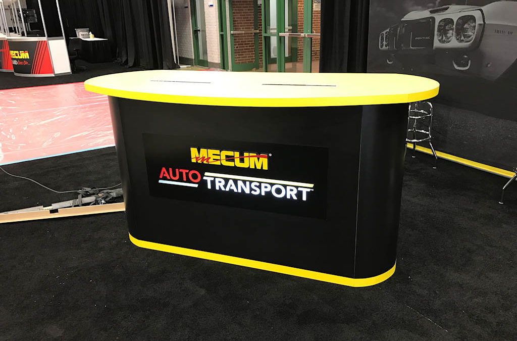 Custom Desk Signs For Mecum Auto Auction Designed By Electremedia